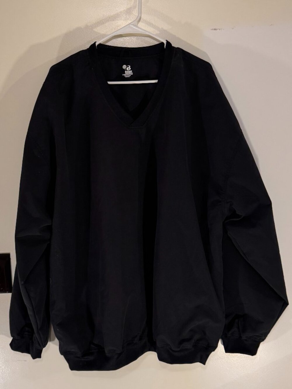 Badger long sleeve pullover windbreaker black nice front pockets. Never used